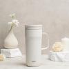 imageZak Designs Harmony Tumbler for Travel or At Home 20oz Recycled Stainless Steel is SplashProof and Vacuum Insulated with Slide Lid and Handle Ebony BlackCream White